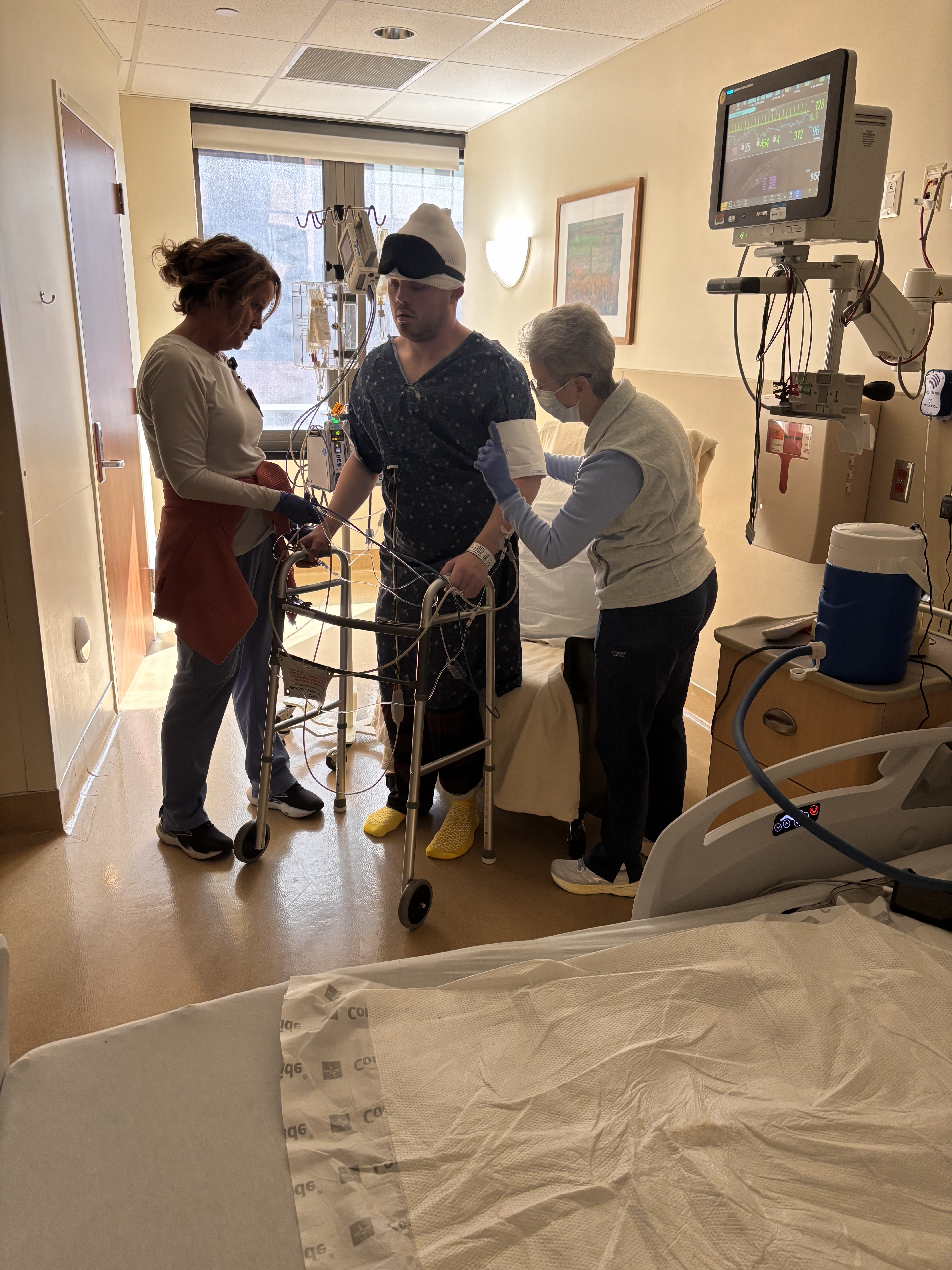 Joe standing for the first time after surgery